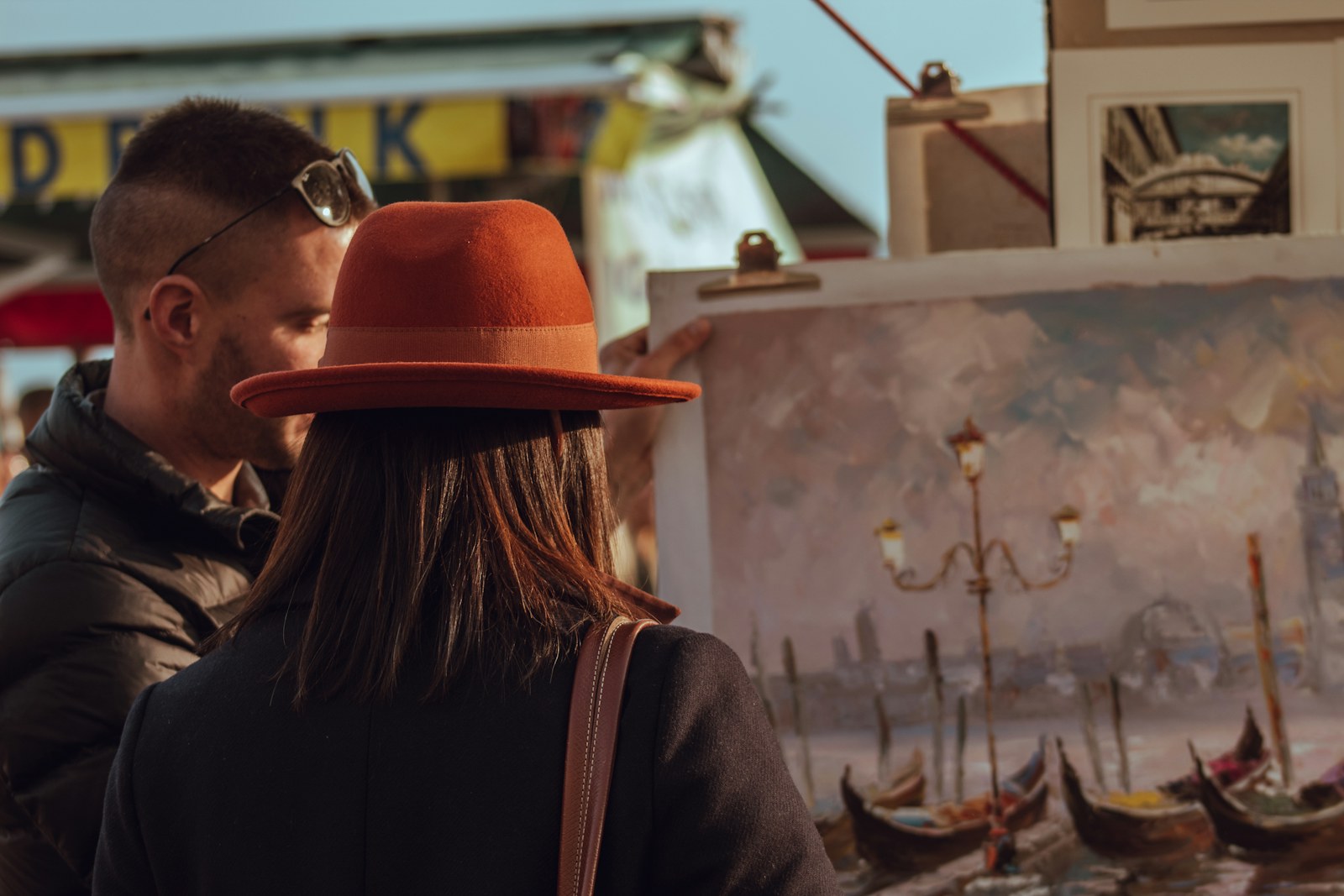 Couple looking at a painting in an art gallery