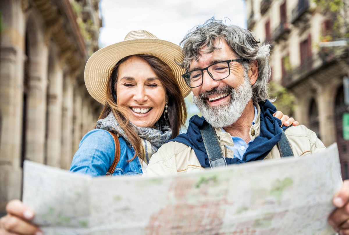 Couple reading a map while exploring the city