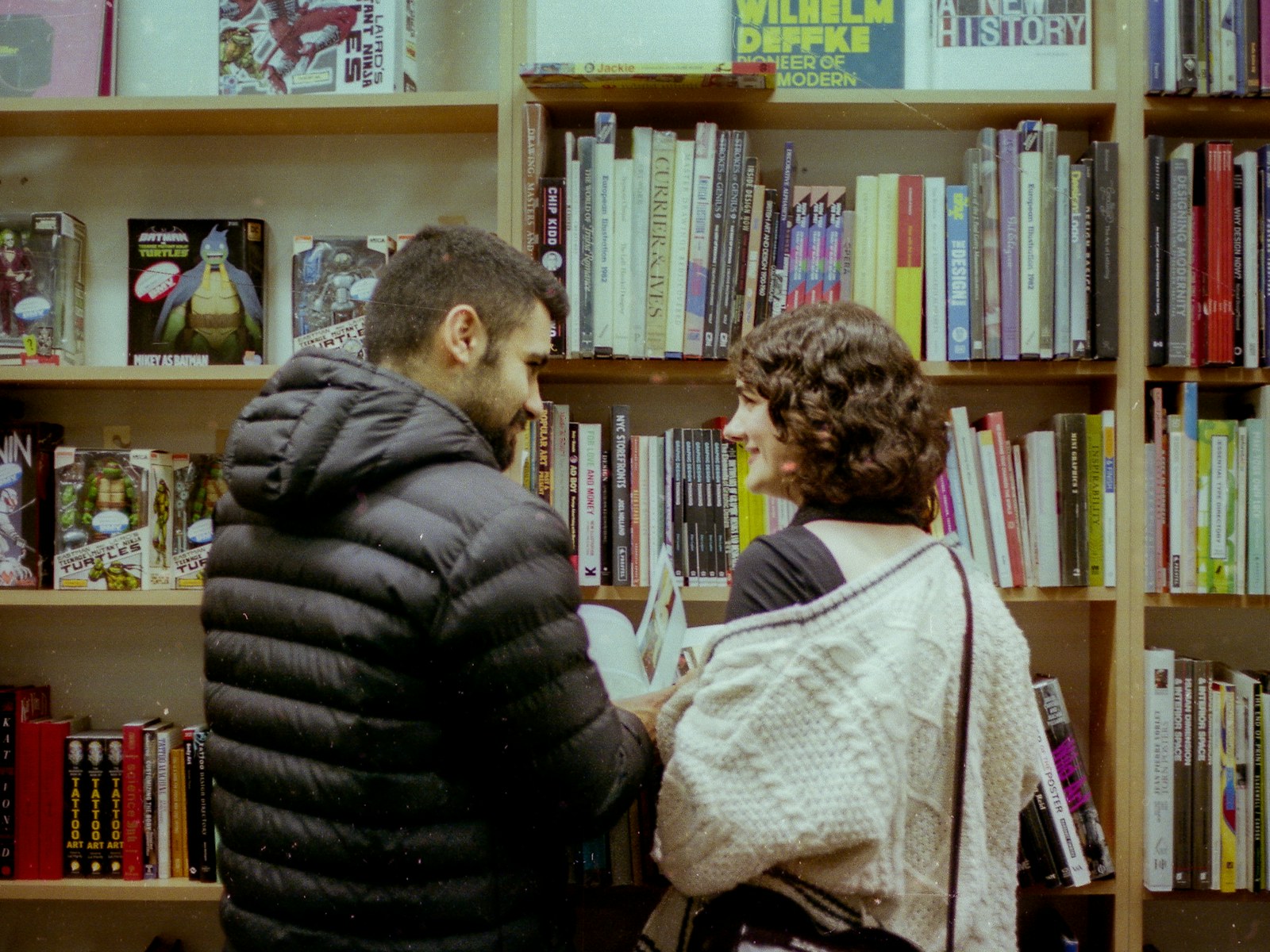 Couple browsing books together in a bookstore